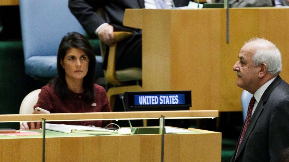 PHOTO: Riyad Mansour (R), Palestine's Permanent Observer to the United Nations, walks past U.S. Ambassador to the United Nations Nikki Haley (L), at the U.N. General Assembly, Dec. 21, 2017, at United Nations headquarters in New York.