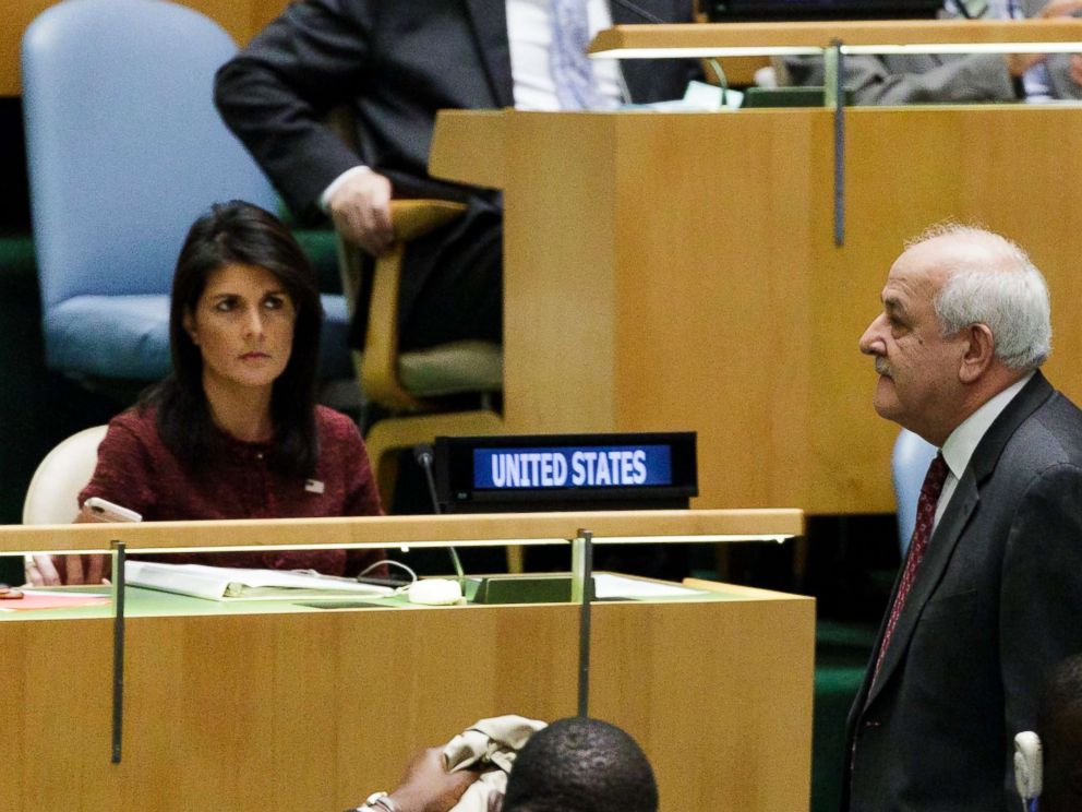 PHOTO: Riyad Mansour (R), Palestines Permanent Observer to the United Nations, walks past U.S. Ambassador to the United Nations Nikki Haley (L), at the U.N. General Assembly, Dec. 21, 2017, at United Nations headquarters in New York.