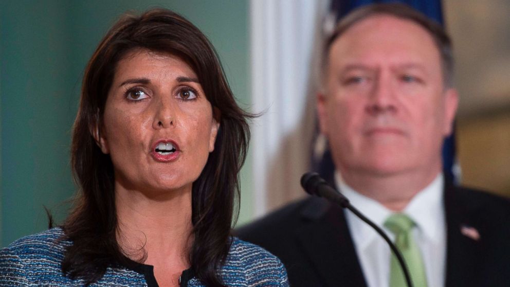 PHOTO: Secretary of State Mike Pompeo looks on as Ambassador to the United Nation Nikki Haley speaks at the Department of State in Washington on June 19, 2018.