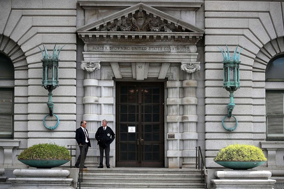 PHOTO: Security guards stand in front of the Ninth U.S. Circuit Court of Appeals  on June 12, 2017, in San Francisco.