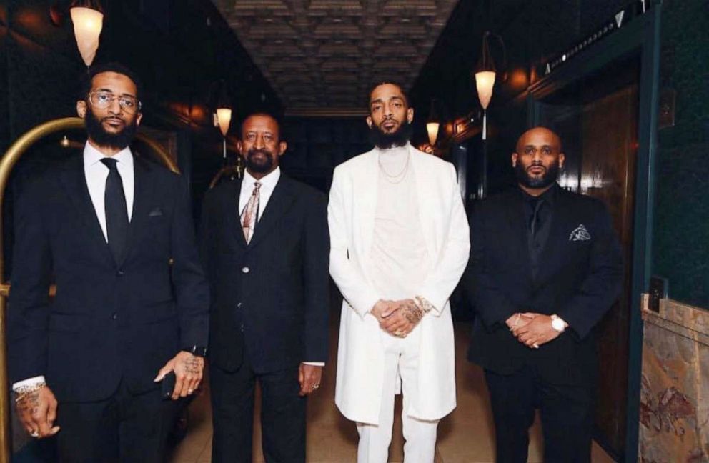 PHOTO: Nipsey Hussle with his brother Samiel Asghedom, left, father Dawit Asghedom, center, and brother Adam Andebrhan.