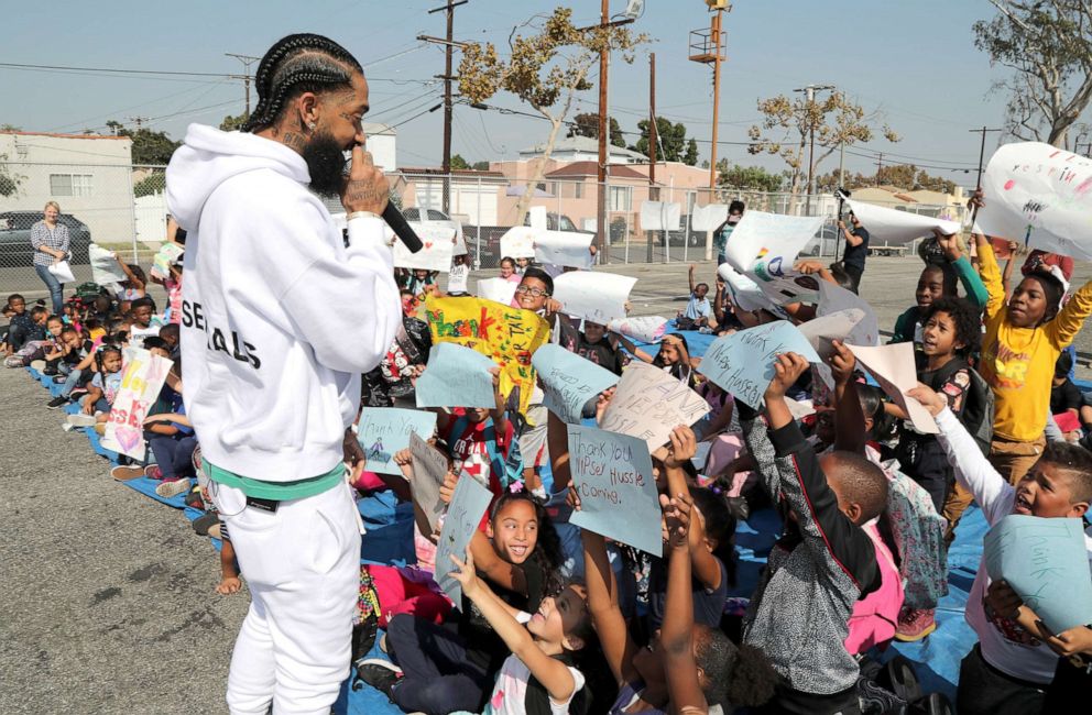 PHOTO: Nipsey Hussle speaks to kids at the Nipsey Hussle x PUMA Hoops Basketball Court Refurbishment Reveal event, Oct. 22, 2018, in Los Angeles.