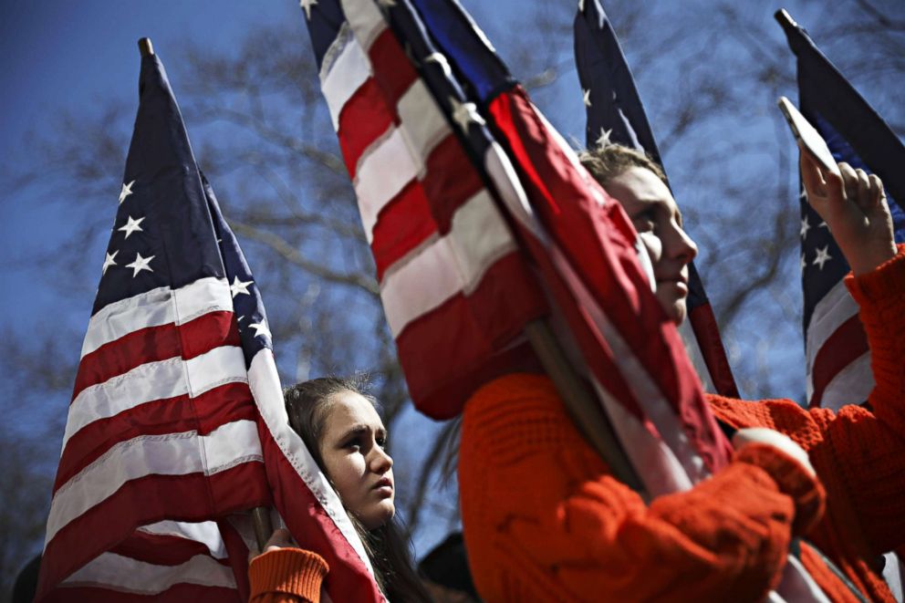 PHOTO:New Jersey high school students hold American flags during the March For Our Lives event near Columbus Circle, March 24, 2018 in New York City.  