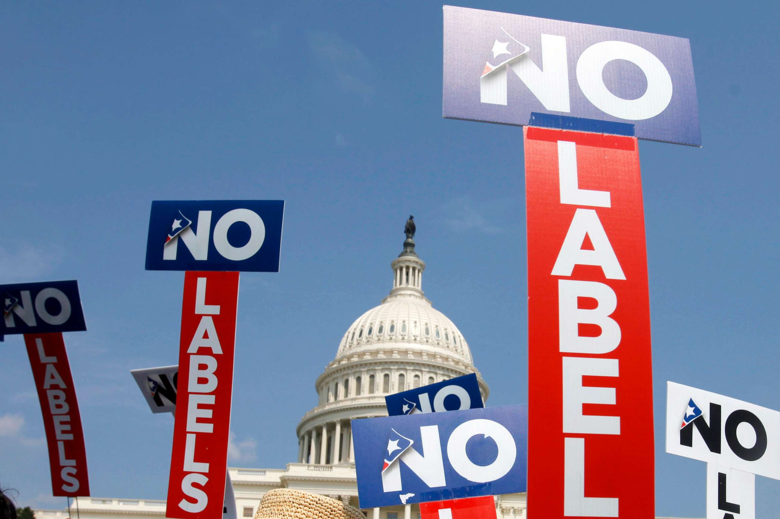 PHOTO: In this July 18, 2011, file photo, people with the group No Labels hold signs during a rally on Capitol Hill in Washington, D.C.