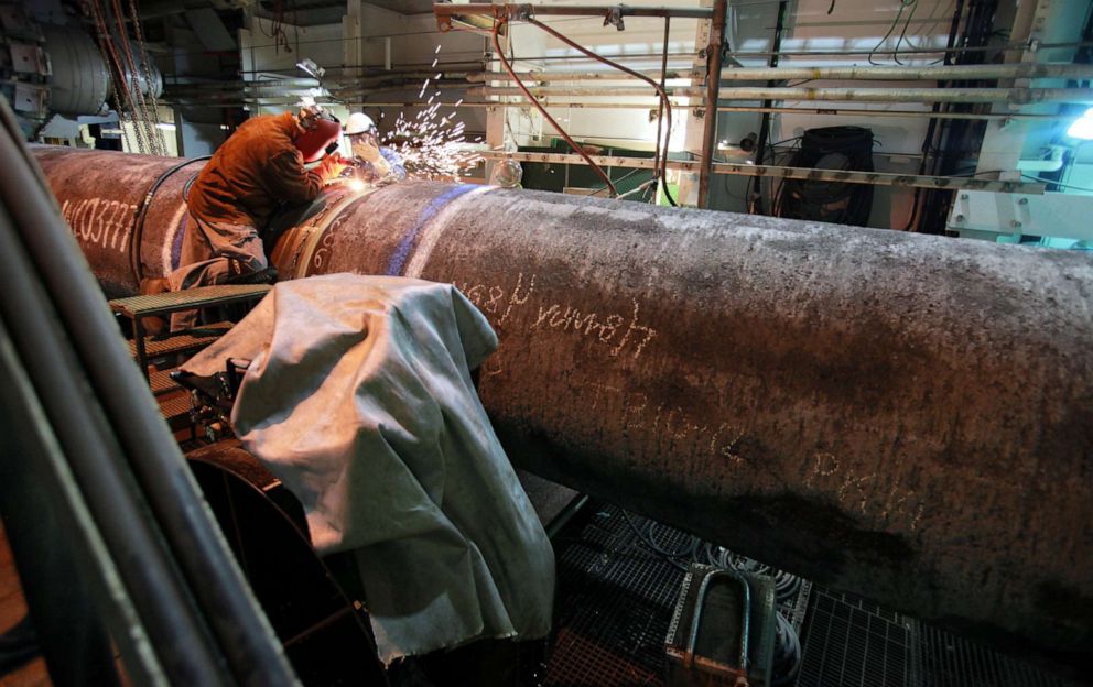 PHOTO: Workers prepare a metal pipeline aboard the Solitaire ship to be installed in the Finnish Gulf, 125 miles west of St. Petersburg, on Sept. 20, 2010.