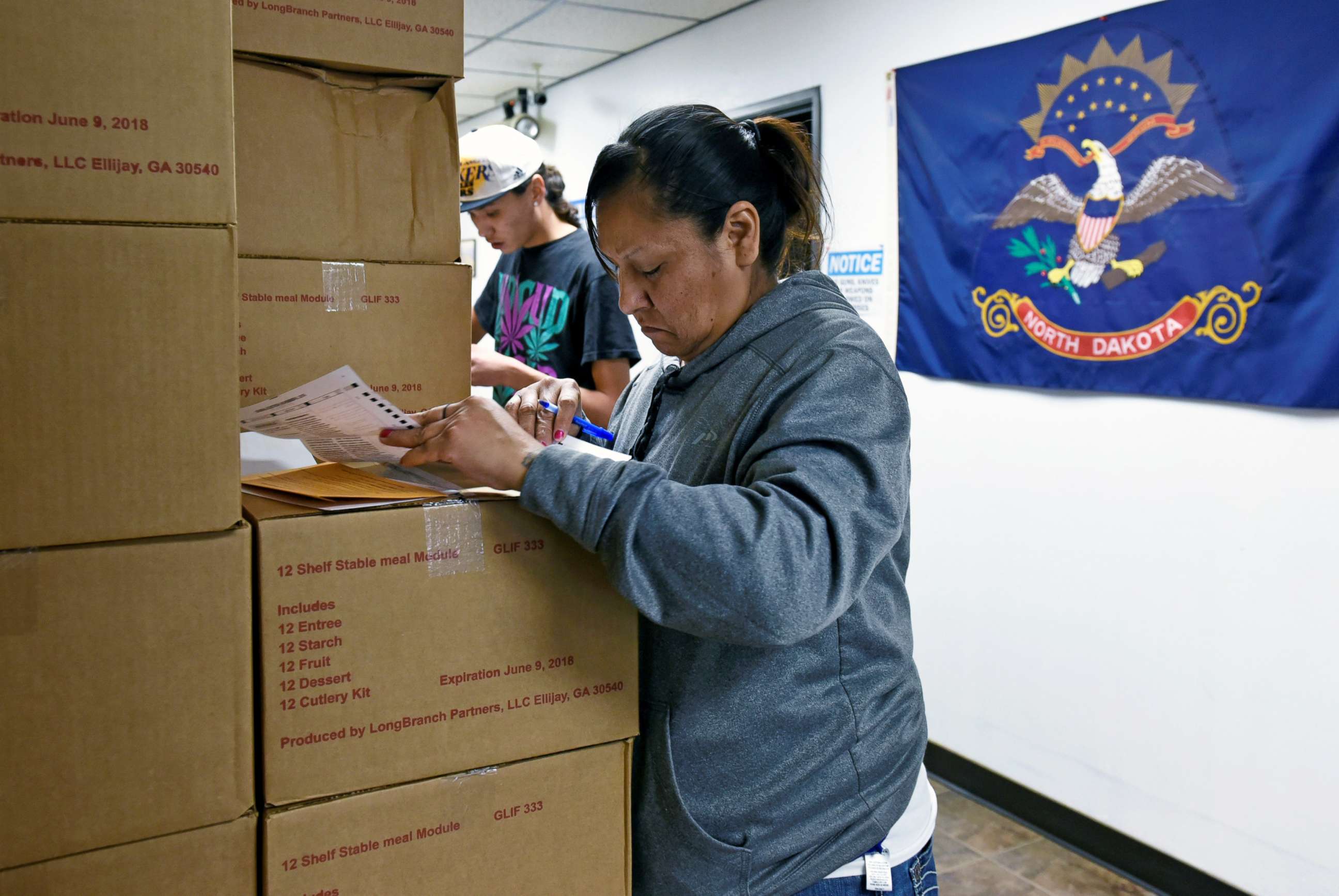 PHOTO: Sherri Two Horses fills out an absentee ballot for the 2018 mid-term election at the Sioux County Court House on the Standing Rock Reservation in Fort Yates, North Dakota, Oct. 26, 2018.