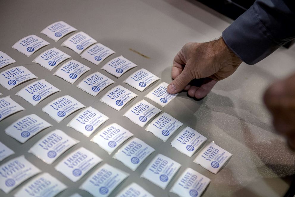 PHOTO: Stickers are laid out for voters at a polling place set up in the Mismarck Event Center in Bismarck, N.D., on Nov. 6, 2018.