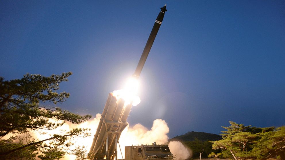 PHOTO: This undated photo released on March 28, 2020, by North Korea's Korean Central News Agency shows the testing of what local media call a super-large multiple rocket launcher in North Korea.