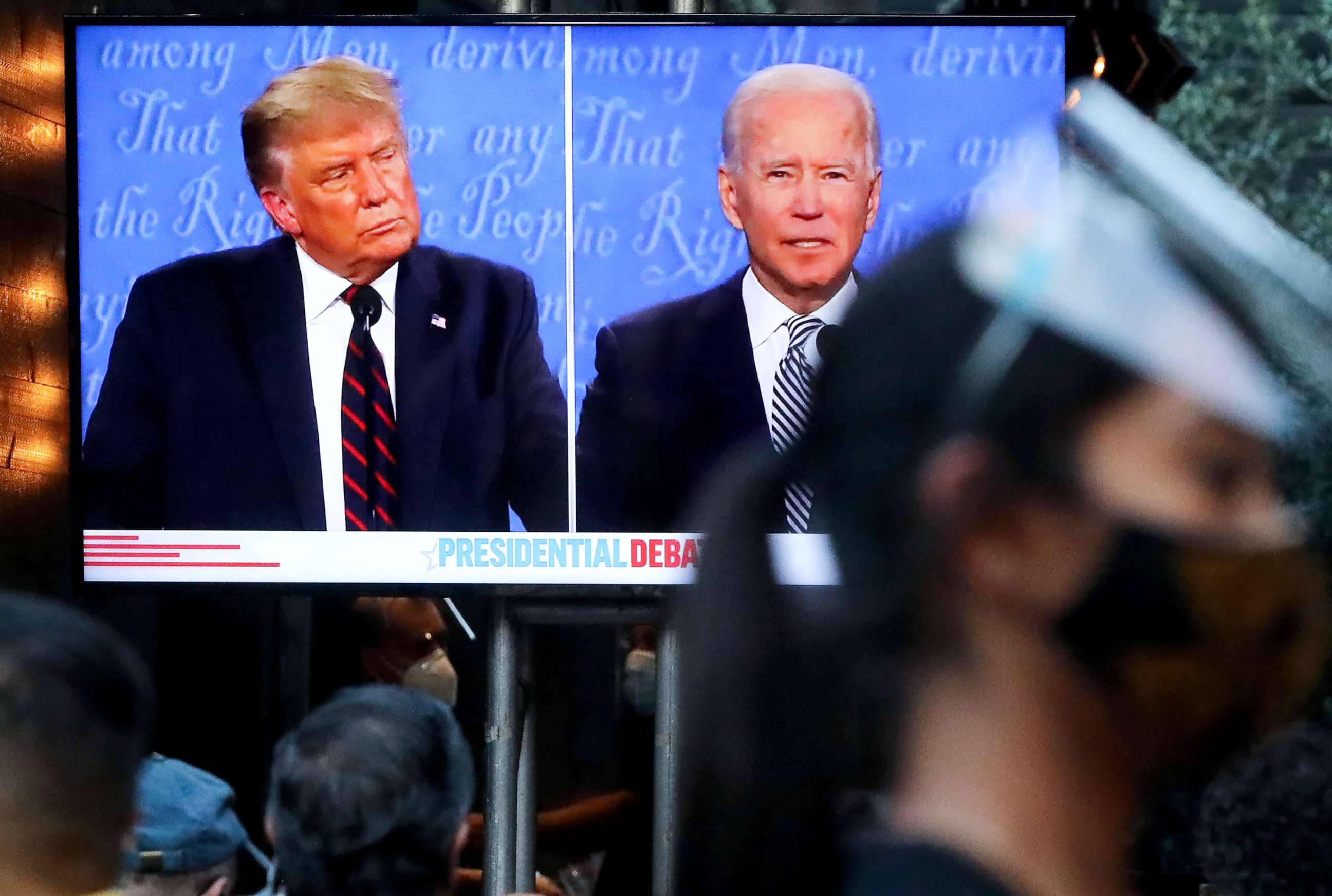 PHOTO: The first debate between President Donald Trump and Democratic presidential nominee Joe Biden in Cleveland is watched by patrons at The Abbey in West Hollywood, Calif., Sept. 29, 2020.