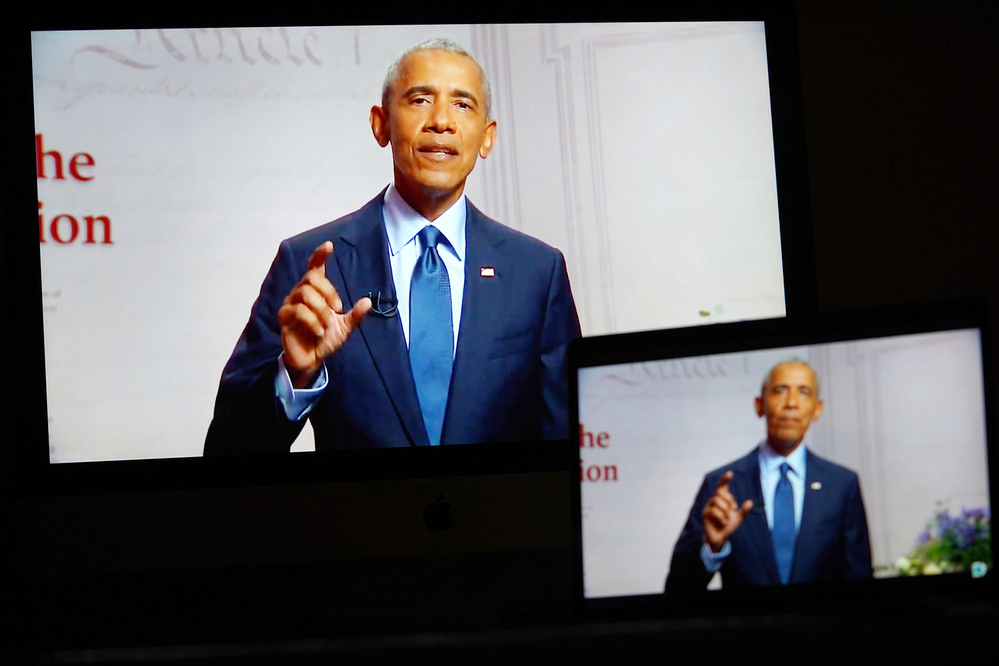 PHOTO: Images of former President Barack Obama speaking in a video feed of the 2020 Democratic National Convention are displayed on screens in Arlington, Va., Aug. 19, 2020.