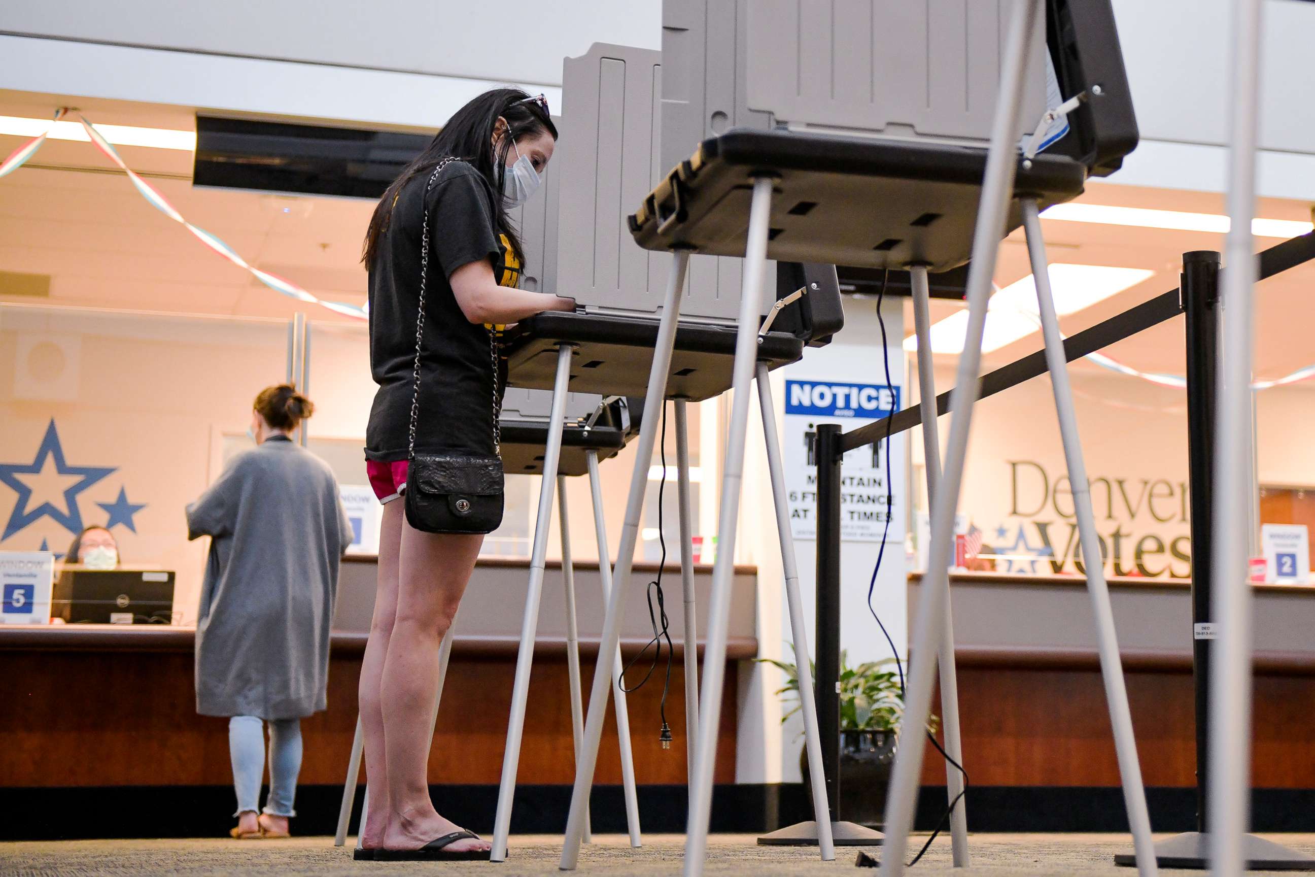PHOTO: Jennifer Gance votes in the primary election at a polling center in Denver, Colo., June 30, 2020.