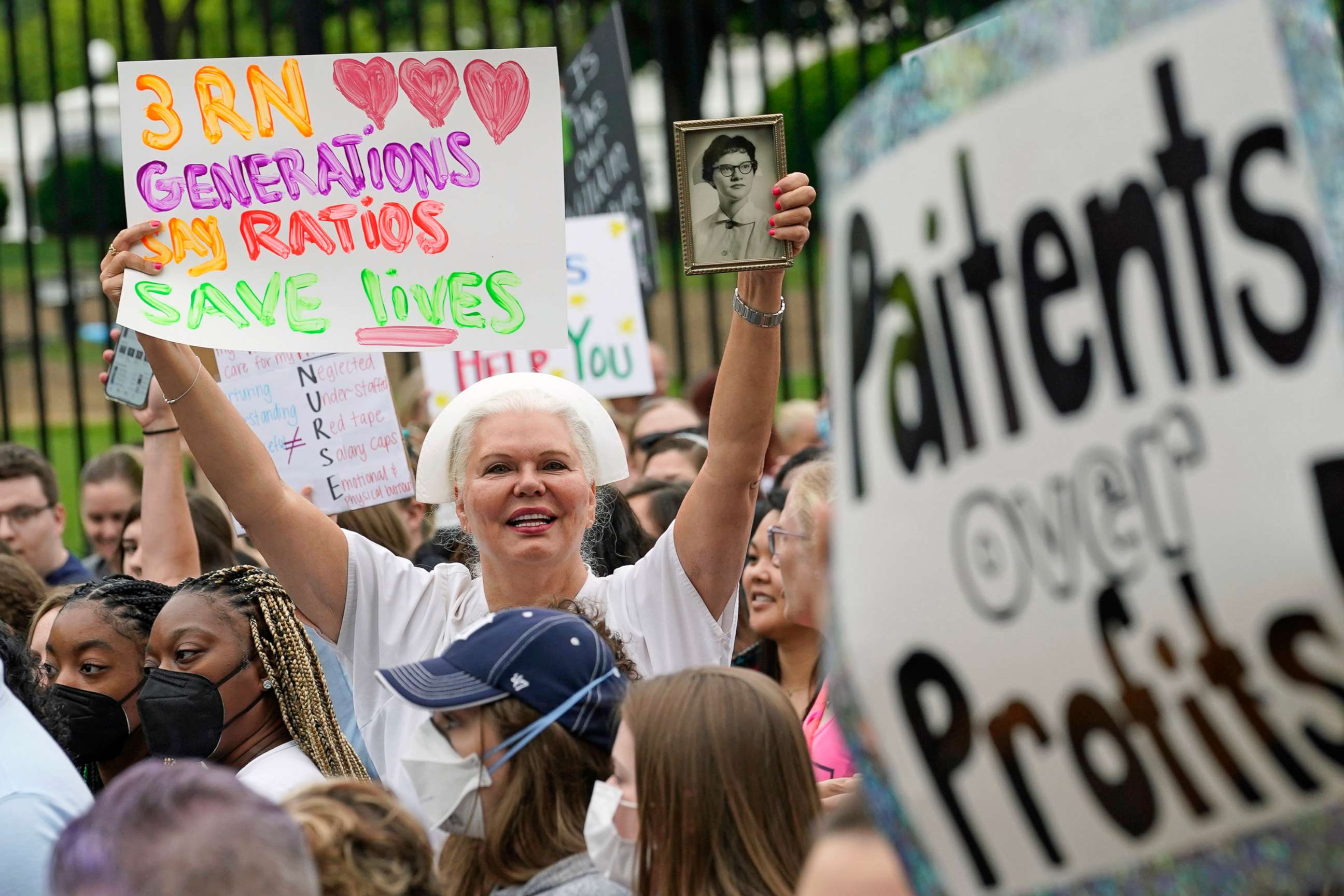 PHOTO: People march outside the White House protesting working conditions of nurses, in Washington, D.C., May 12, 2022. They ask for improved wages, staffing environments and no violence against healthcare workers.