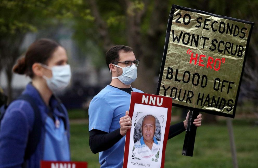 PHOTO: Registered Nurses and members of National Nurses United (NNU), the largest U.S. nurses union, rally outside of the White House, April 21, 2020, on behalf of health care workers who have become infected with the coronavirus disease.