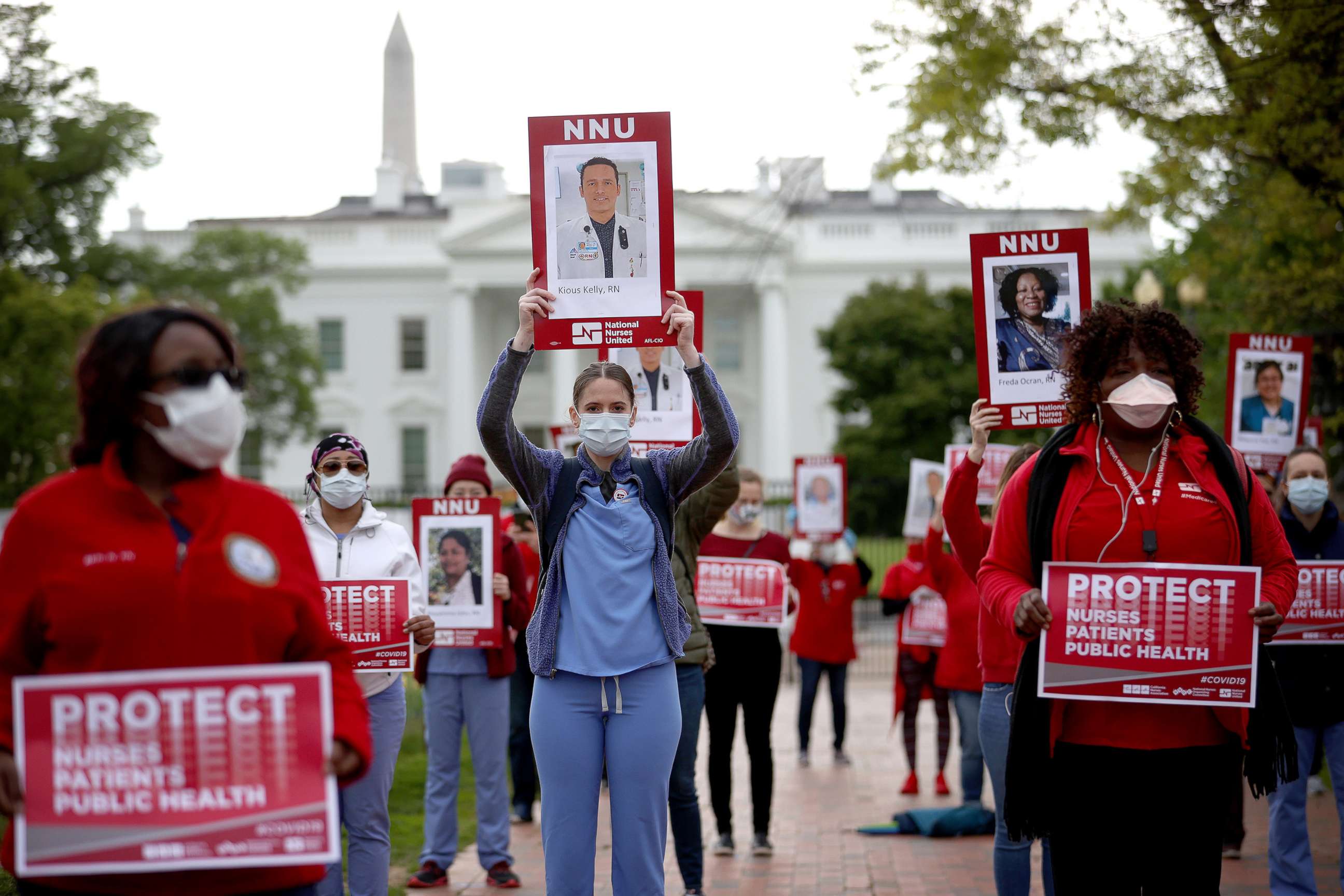 PHOTO: Registered nurses who are members of National Nurses United, the largest nurses union in the United States, protest in front of the White House, April 21, 2020 in Washington, D.C., to draw attention to the lack of personal protective equipment.