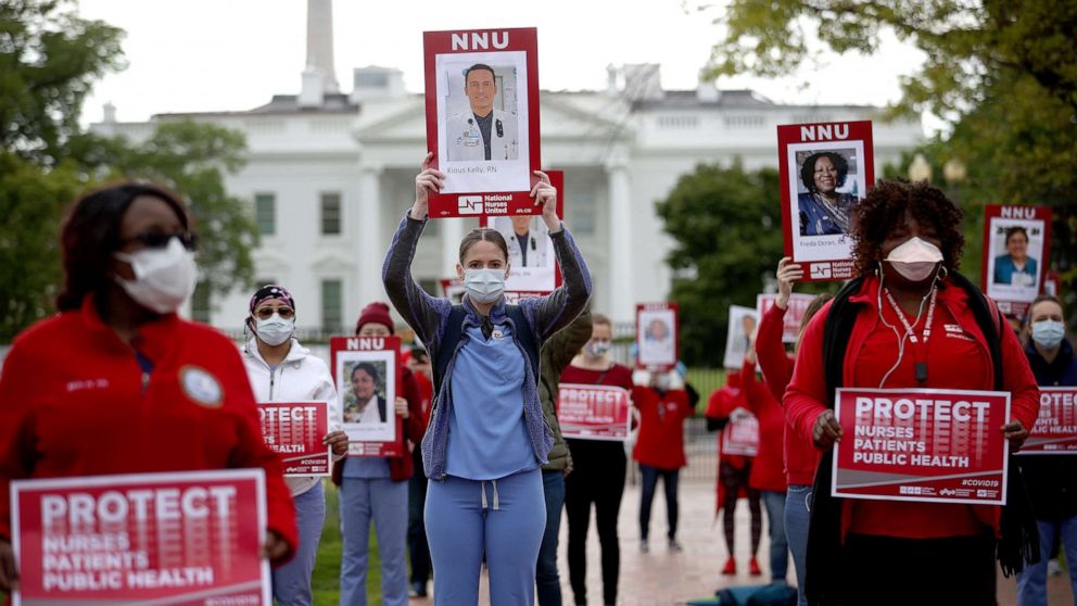 PHOTO: Registered nurses who are members of National Nurses United, the largest nurses union in the United States, protest in front of the White House, April 21, 2020 in Washington, D.C., to draw attention to the lack of personal protective equipment.