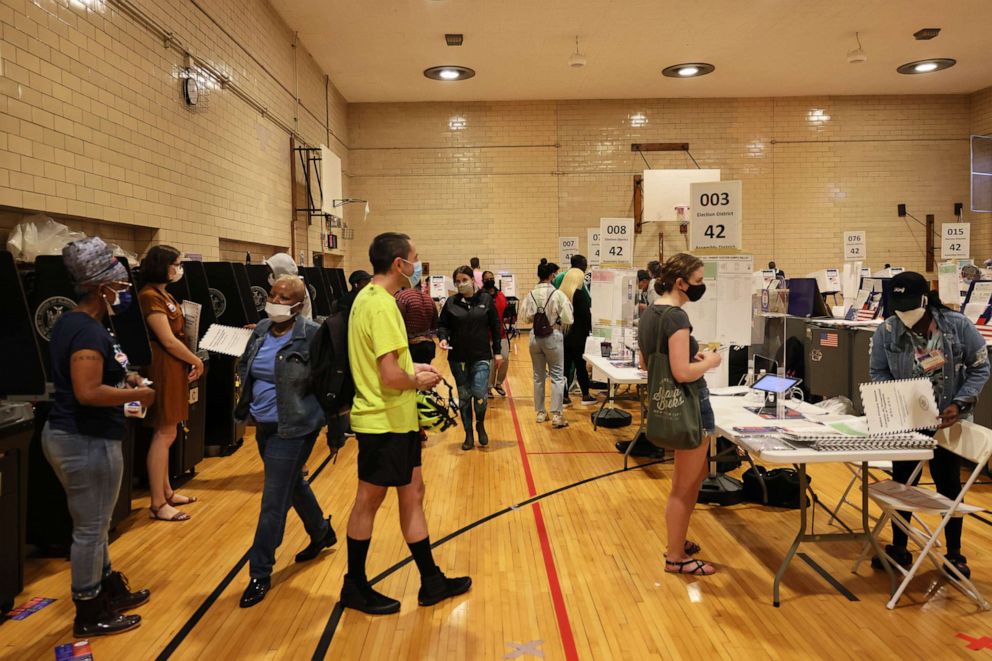 People prepare to vote in the New York City mayoral primary at P.S. 249 The Caton School on June 22, 2021.