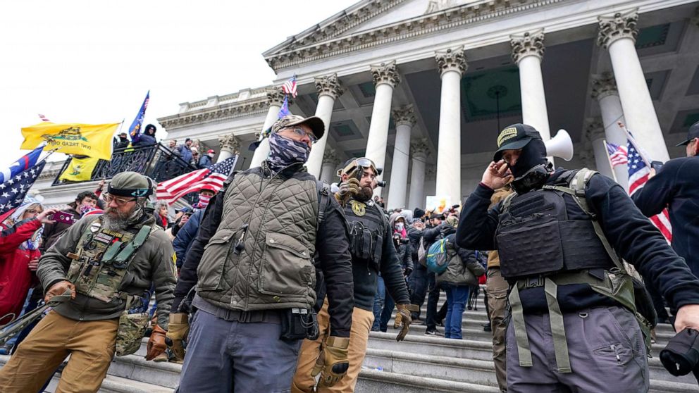 PHOTO: Members of the Oath Keepers stand on the East Front of the U.S. Capitol on Jan. 6, 2021, in Washington, D.C. 