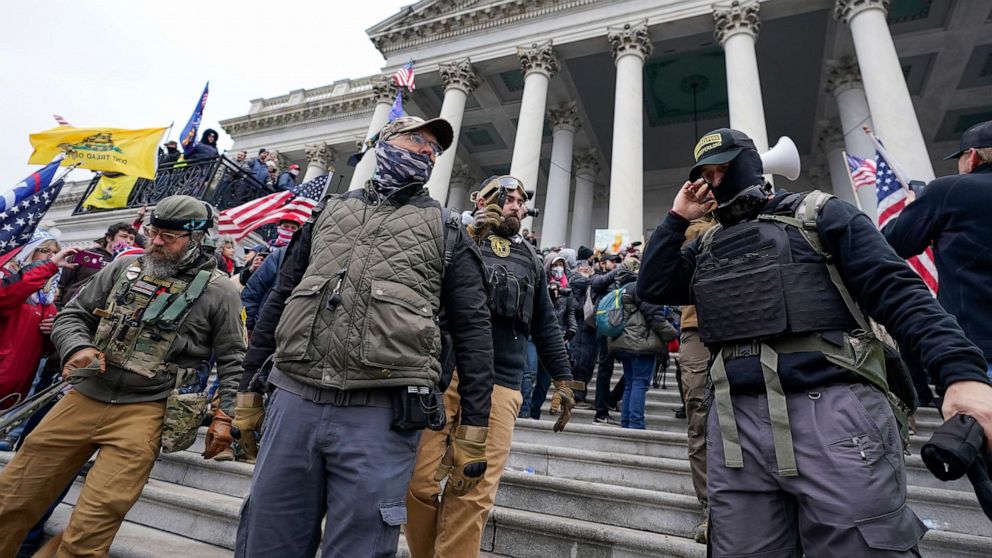 PHOTO: Members of the Oath Keepers extremist group stand on the East Front of the U.S. Capitol on Jan. 6, 2021, in Washington, D.C.