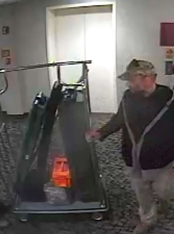 PHOTO: A screen grab from surveillance video released by prosecutors shows Kenneth Harrelson at the Comfort Inn Ballston in Arlington, Va.,"wheeling what appears to be at least one rifle case down a hallway," Jan. 7, 2020.