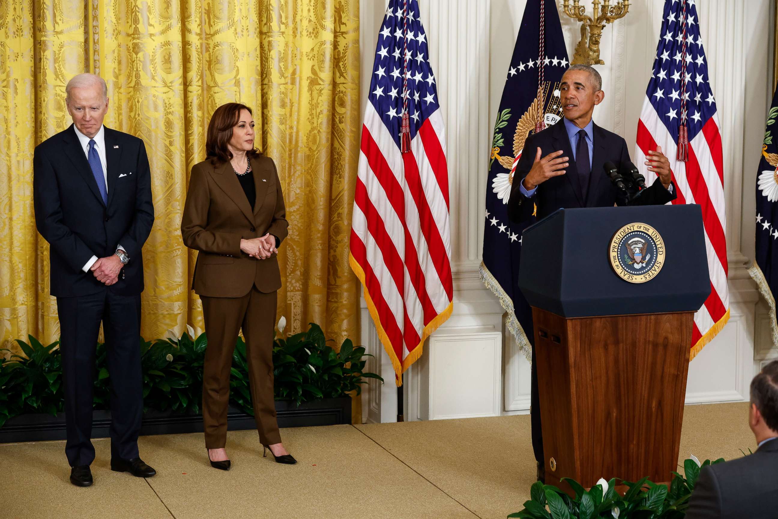 PHOTO: President Joe Biden and Vice President Kamala Harris look on as former President Barack Obama speaks during an event to mark the 2010 passage of the Affordable Care Act in the East Room of the White House, April 5, 2022 in Washington, DC.