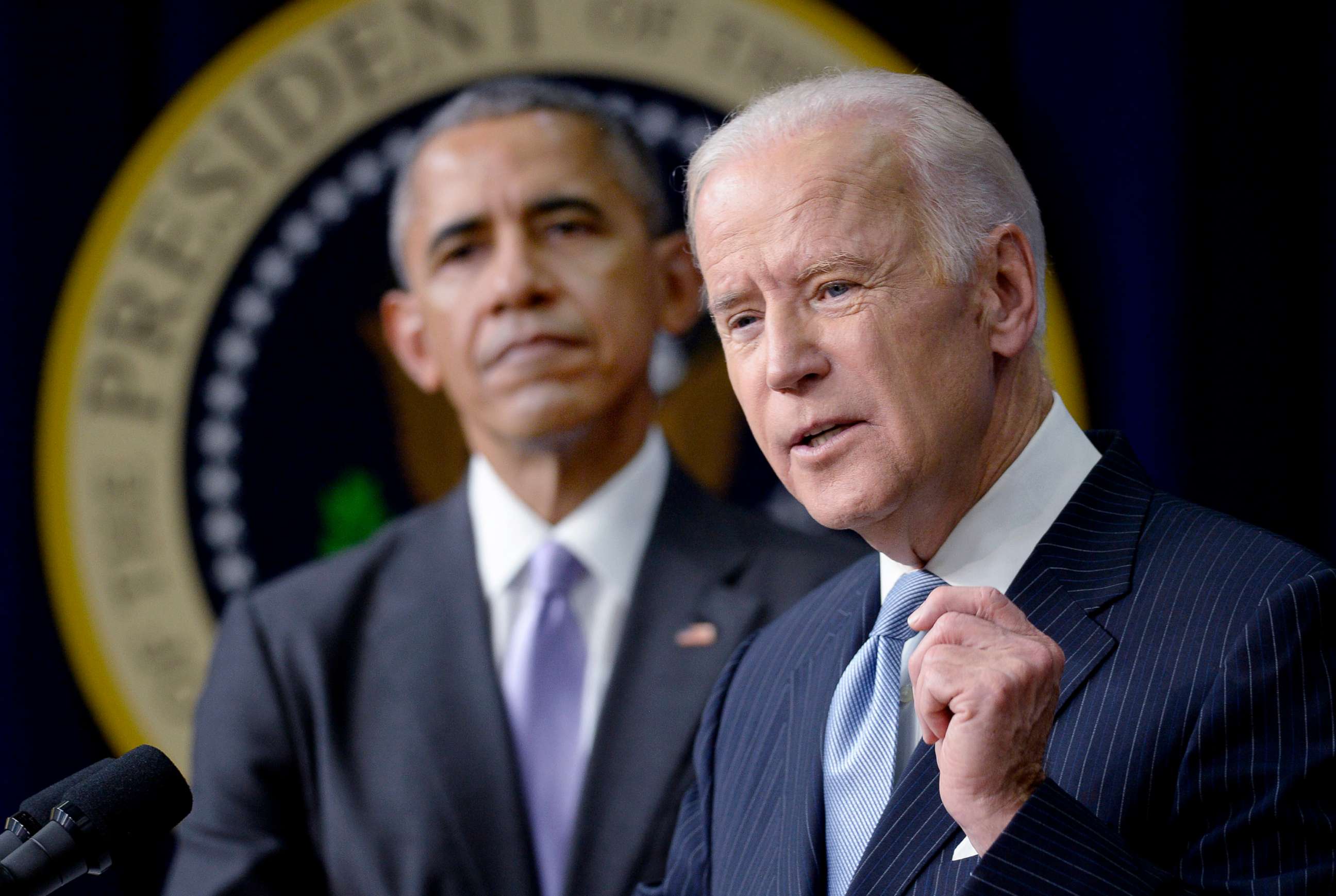 PHOTO: Vice President Joe Biden speaks as President Barack Obama looks during a bill signing in Washington, D.C., Dec. 13, 2016.