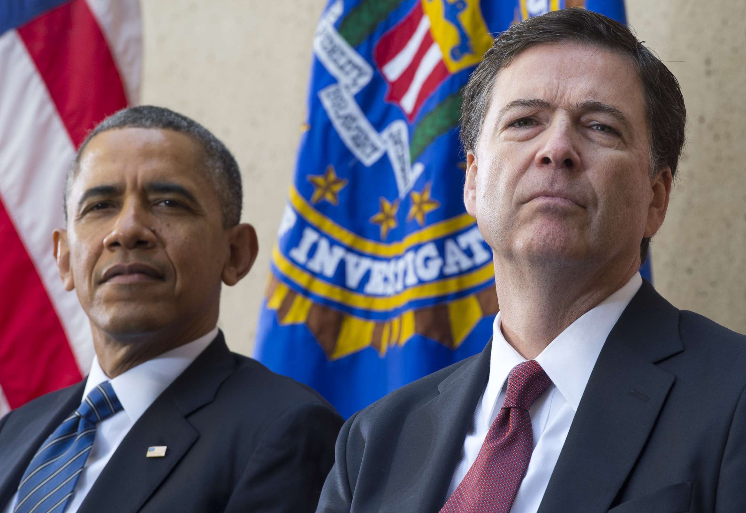 PHOTO: Barack Obama sits alongside James Comey during an installation ceremony at Federal Bureau of Investigation Headquarters in Washington, DC, Oct. 28, 2013.