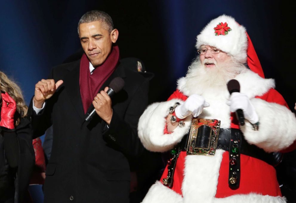 PHOTO: President Barack Obama dances with Santa Claus at the lighting of the National Christmas Tree, Dec. 4, 2014 in Washington.