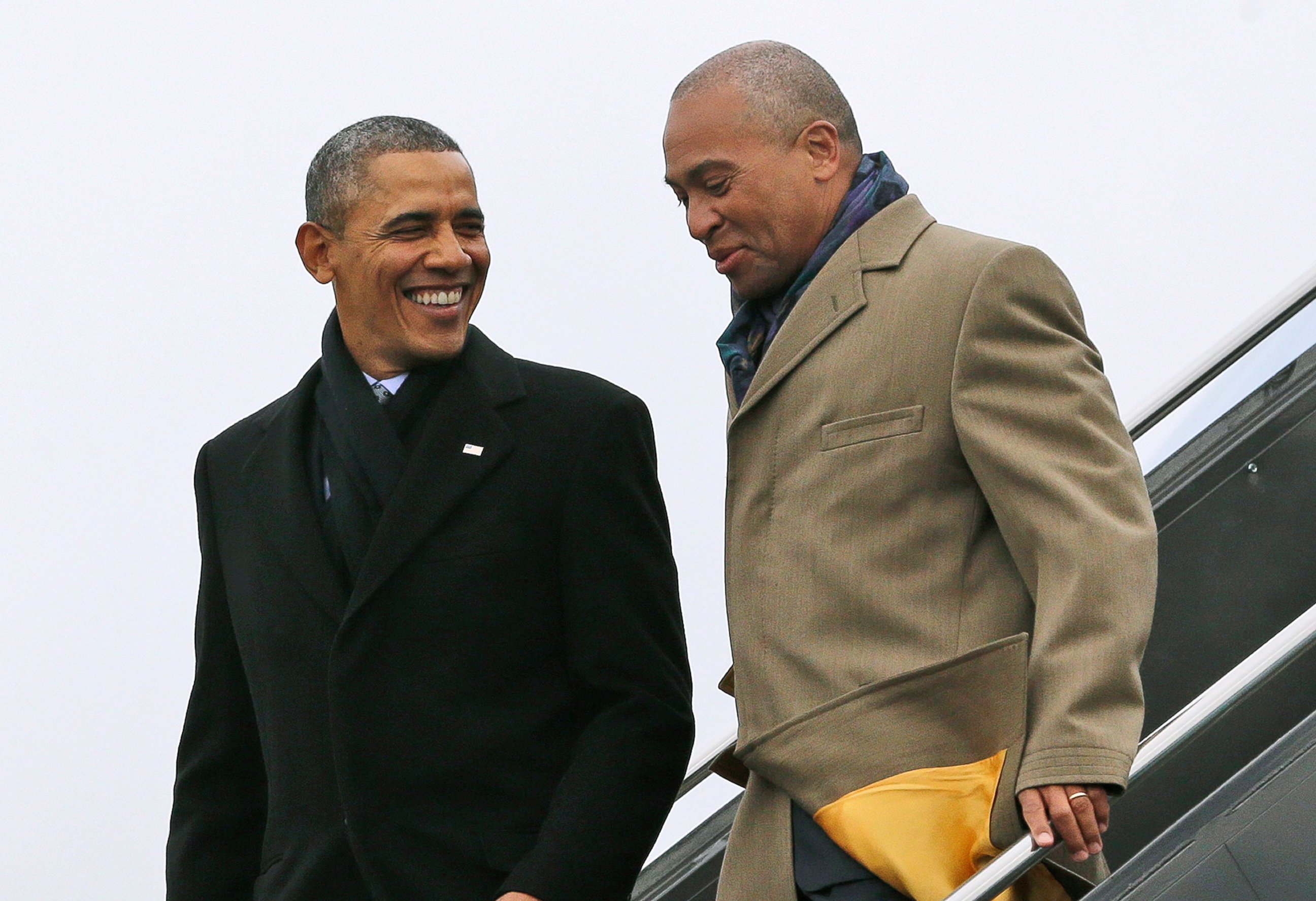 PHOTO: In this March 5, 2014 file photo, President Barack Obama, left, speaks with Massachusetts Gov. Deval Patrick upon arrival on Air Force One at Boston Logan International Airport in Boston.