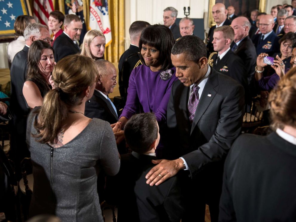 PHOTO: President Barack Obama and first lady Michelle Obama greet family members of fallen soldiers after a Medal of Honor ceremony in the East Room of the White House, 
Feb. 11, 2013.