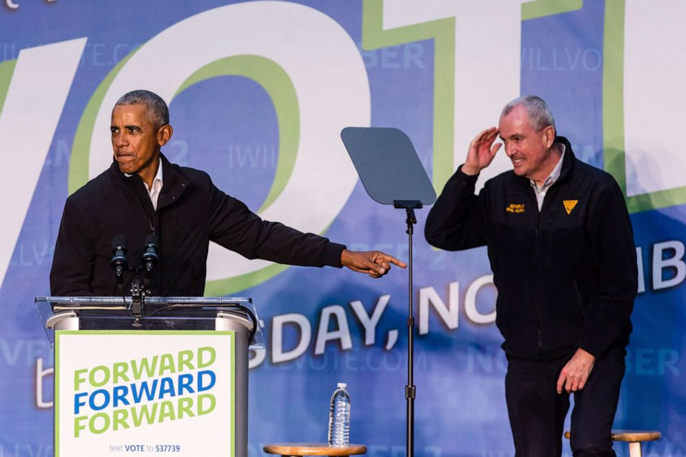 PHOTO: Former President Barack Obama points toward Gov. Phil Murphy, who salutes him on stage, during an early vote rally at Weequahic Park, Saturday, Oct. 23, 2021, in Newark, N.J.