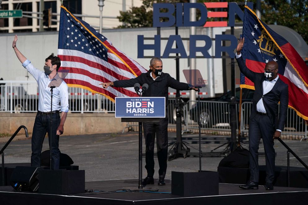PHOTO: Former President Barack Obama, flanked by senate candidates Jon Ossoff and Raphael Warnock, speaks during a Get Out the Vote rally in Atlanta, Nov. 2, 2020.