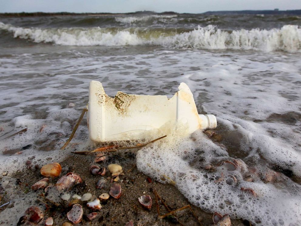 PHOTO: A plastic container litters the beach in Sandy Hook, N.J., April 18, 2011.