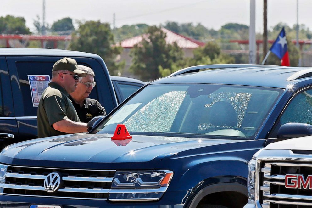 PHOTO: Officials at the scene in Odessa, Texas on Sept. 2, 2019, where teenager Leilah Hernandez was fatally shot at a car dealership during a shooting rampage that killed seven.