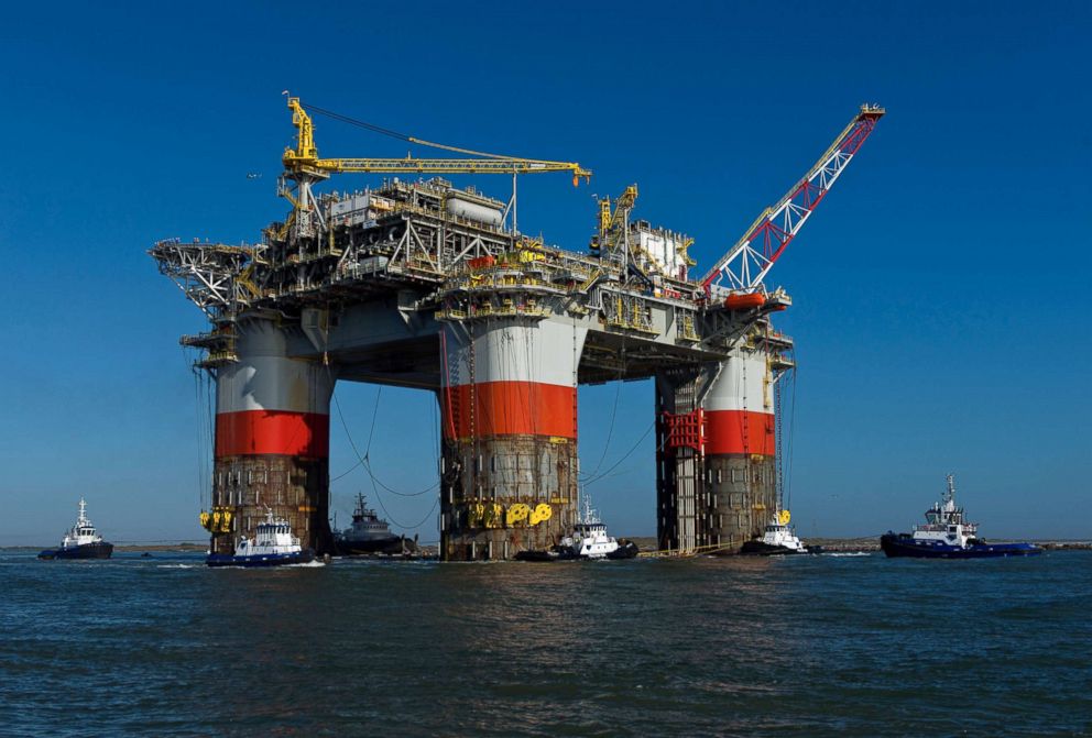 PHOTO: Tug boats transport the Chevron Corp. Jack St. Malo semi-submersible drilling and production platform to the Gulf of Mexico from Kiewit Offshore Services in Ingleside, Texas, Nov. 15, 2013.