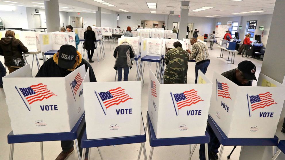 PHOTO: People participate in early voting, Friday, March 13, 2020, in Cleveland.