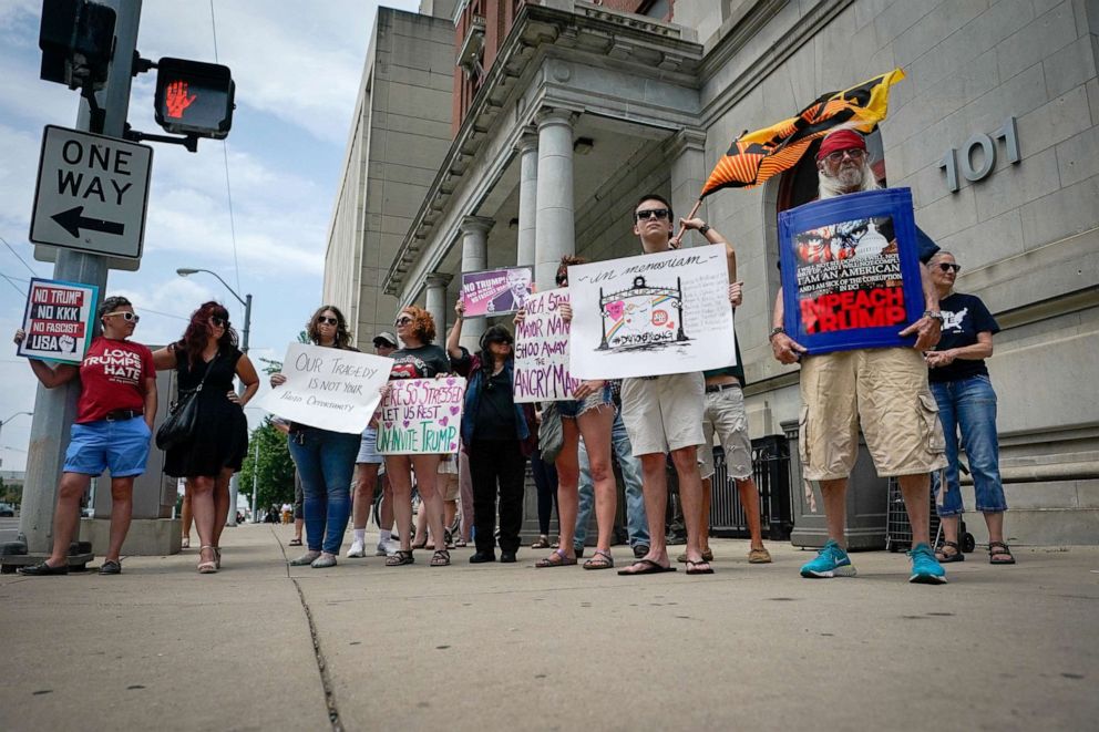 PHOTO: A small group of protesters gather at city hall in opposition to U.S. President Donald Trump visit to Dayton following a mass shooting in Dayton, Ohio, Aug. 6, 2019.