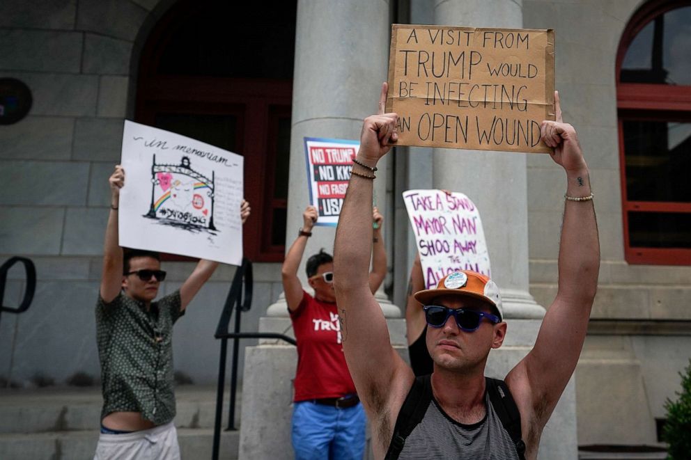 PHOTO: A small group of protesters gather at city hall in opposition to U.S. President Donald Trump visit to Dayton following a mass shooting in Dayton, Ohio, Aug. 6, 2019.