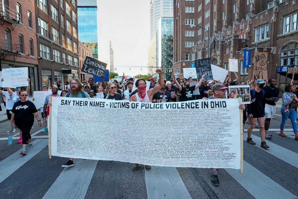 PHOTO: Protesters and family members march from the Columbus Division of Police headquarters through the streets of downtown Columbus following the death of Donovan Lewis, Sep 2, 2022, in Columbus, Ohio. 