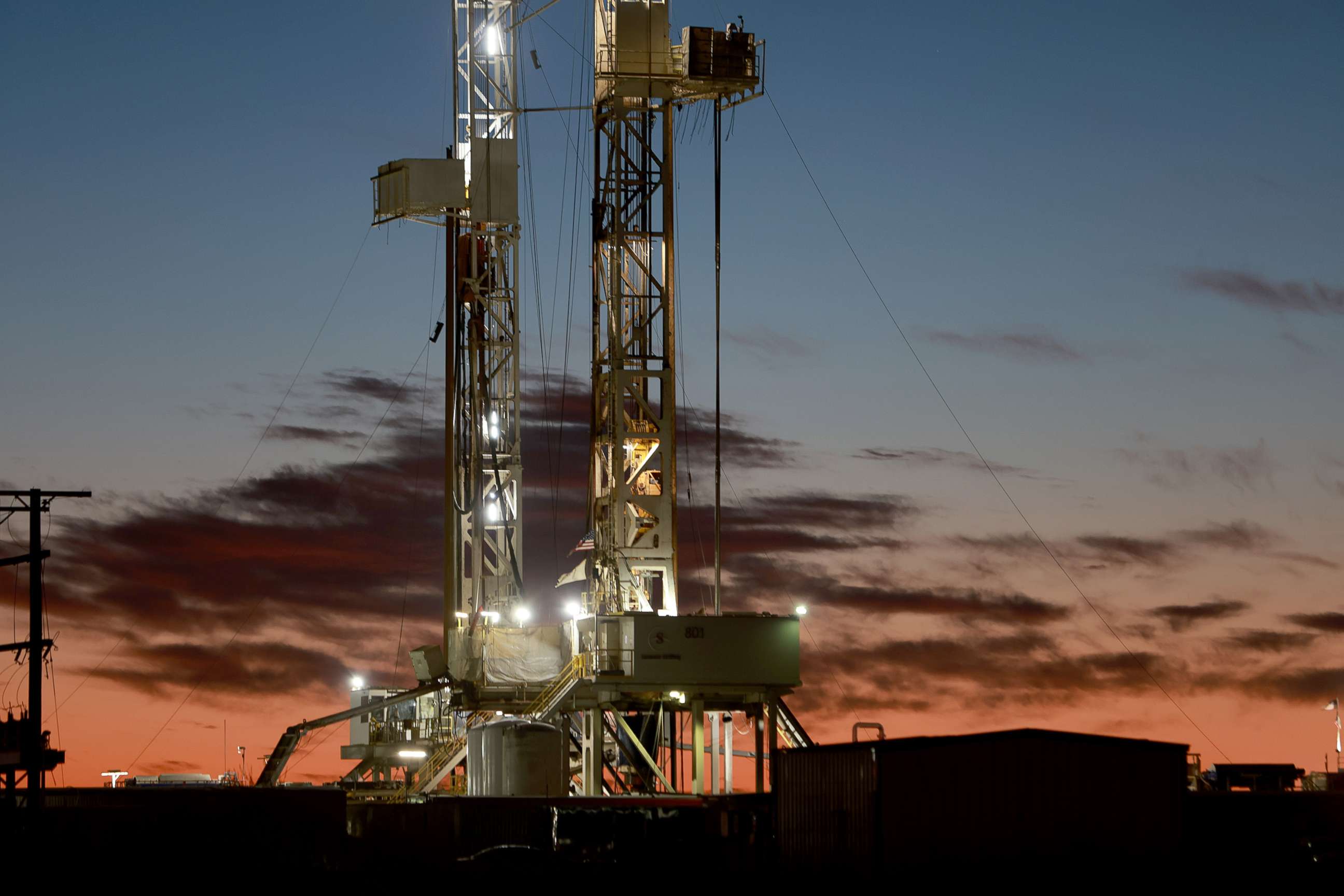 PHOTO: An oil drilling rig setup in the Permian Basin oil field, March 13, 2022, in Midland, Texas.