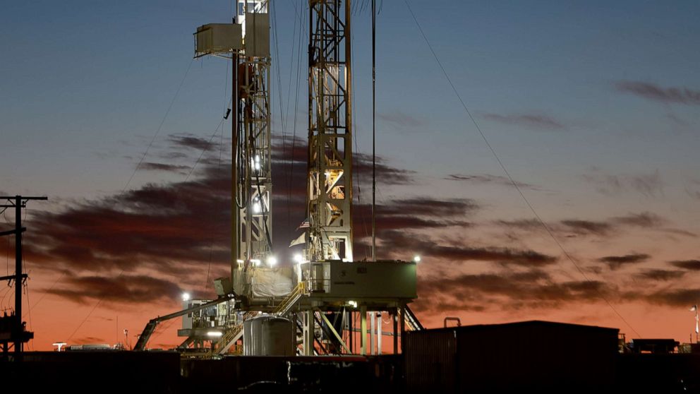 PHOTO: An oil drilling rig setup in the Permian Basin oil field, March 13, 2022, in Midland, Texas.