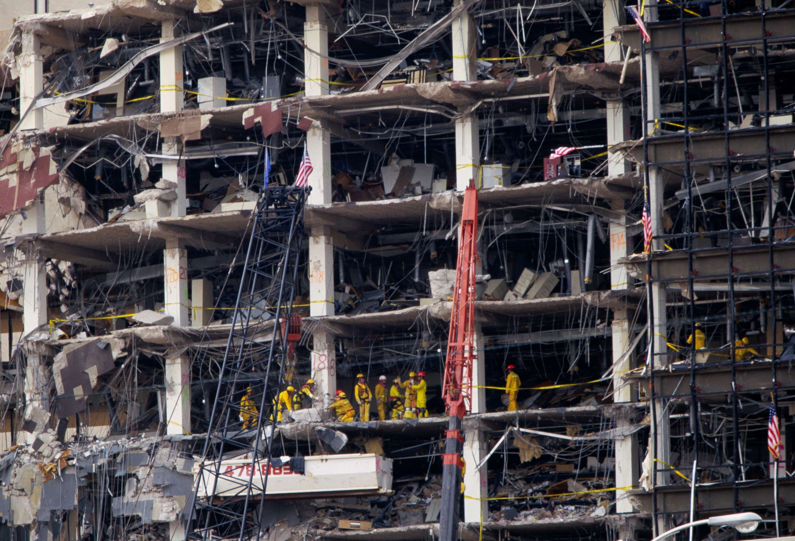 PHOTO: Rescue workers sift through the rubble of the destroyed Federal Building in the aftermath of the Oklahoma City bombing, April 25, 1999.
