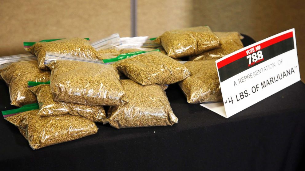 Bags of oregano sit on a table as a representation of what four pounds of marijuana would look like, the amount that would be allowed under SQ788, during a news conference against SQ788 in Oklahoma City, on June 20, 2018.