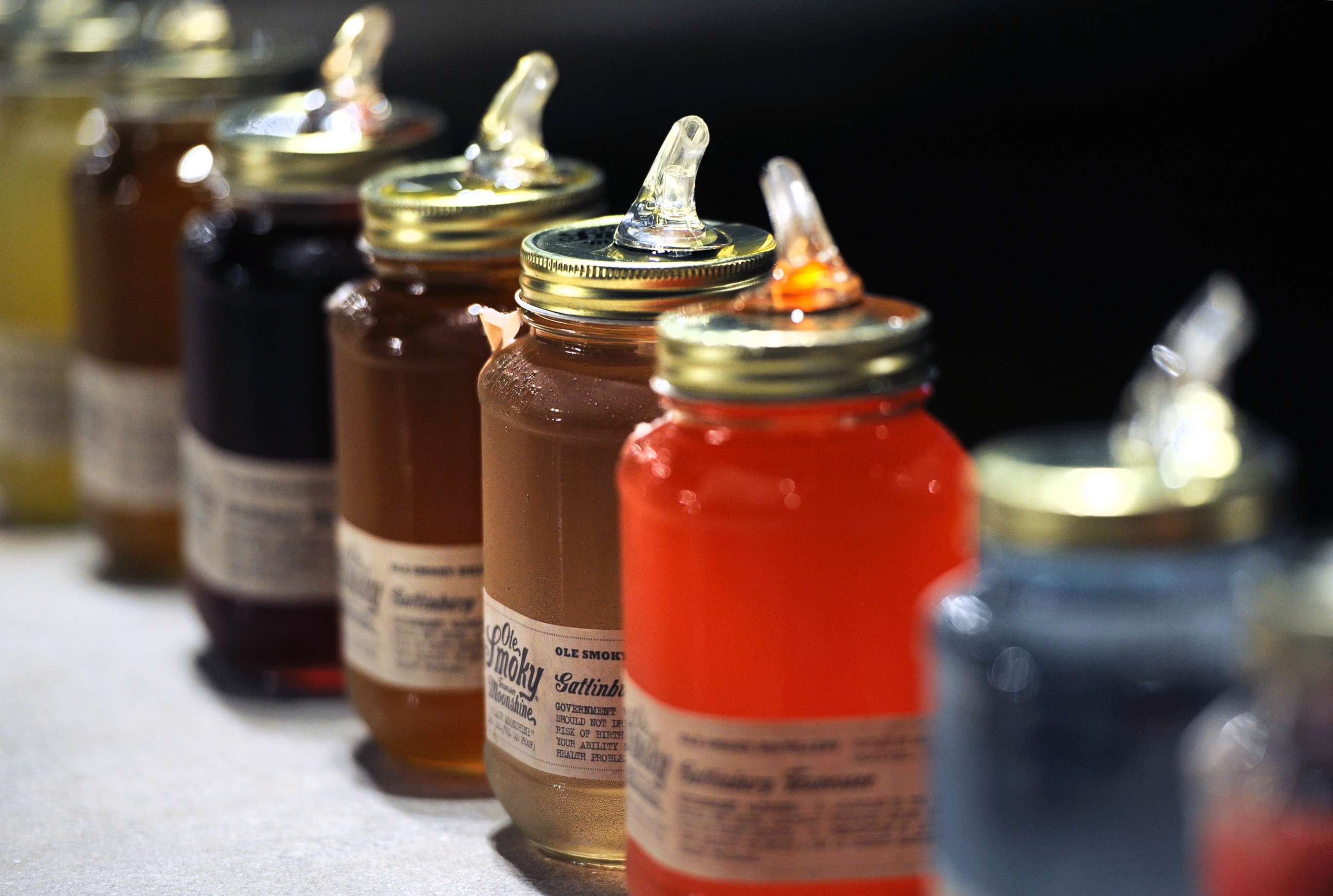 PHOTO: Jars of moonshine for sampling sit on display at Ole Smoky Distillery in Gatlinburg, Tenn., April 16, 2015.