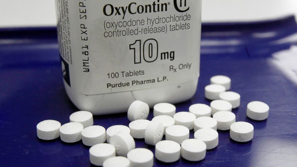 OxyContin pills are arranged for a photo at a pharmacy in Montpelier, Vt., Feb. 19, 2013.