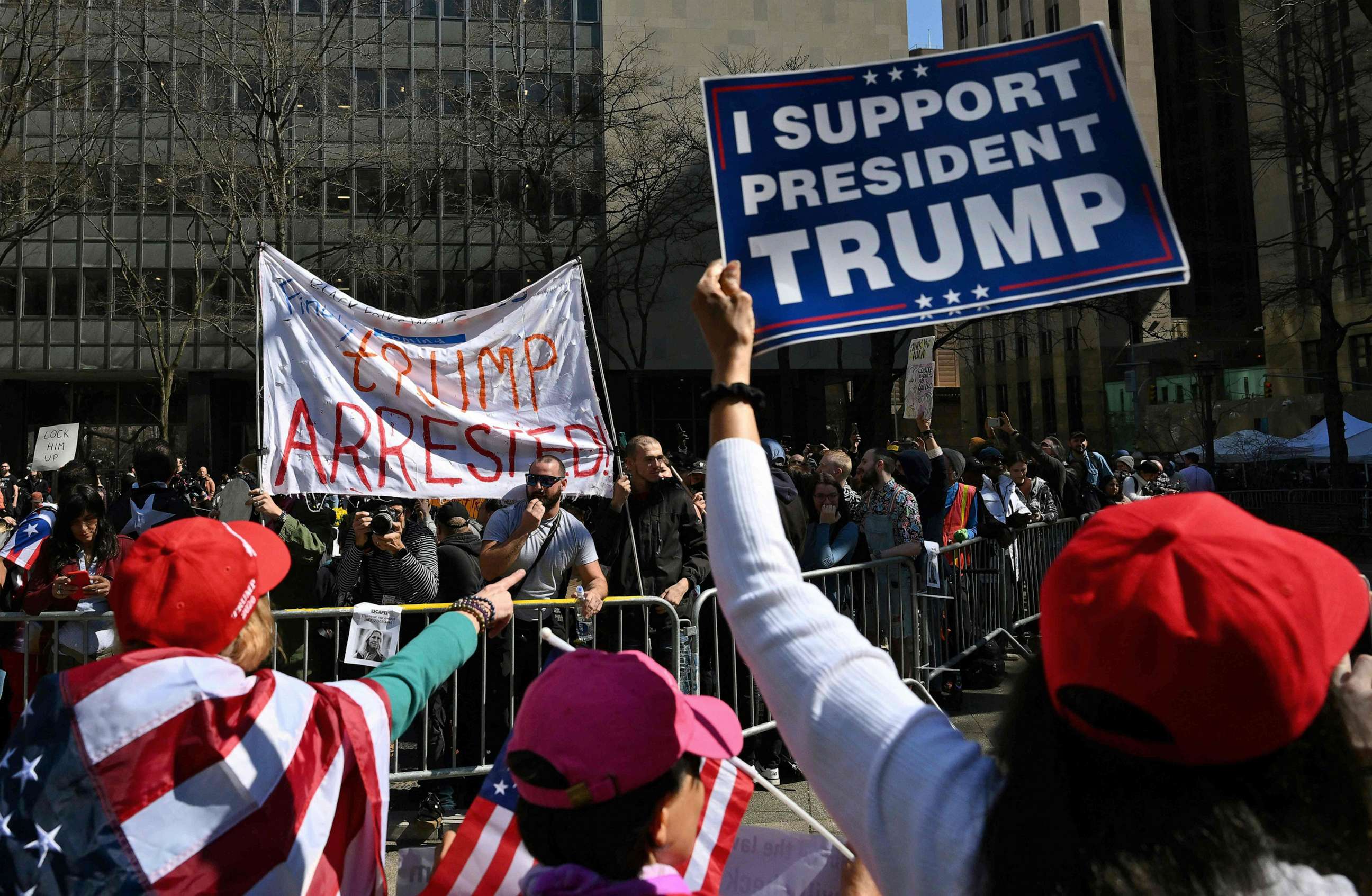 PHOTO: Supporters of former President Donald Trump argue with opponents outside the Manhattan District Attorney's office in New York City on April 4, 2023, ahead of Trump's expected appearance before a New York judge to answer criminal charges.