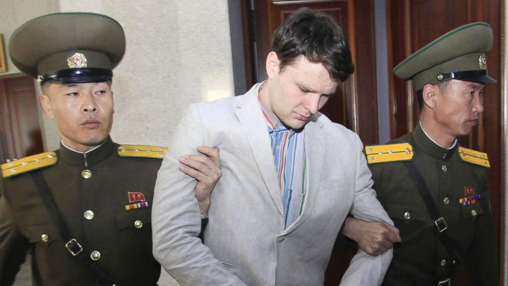 PHOTO: American student Otto Warmbier, center, is escorted at the Supreme Court in Pyongyang, North Korea, on March 16, 2016.