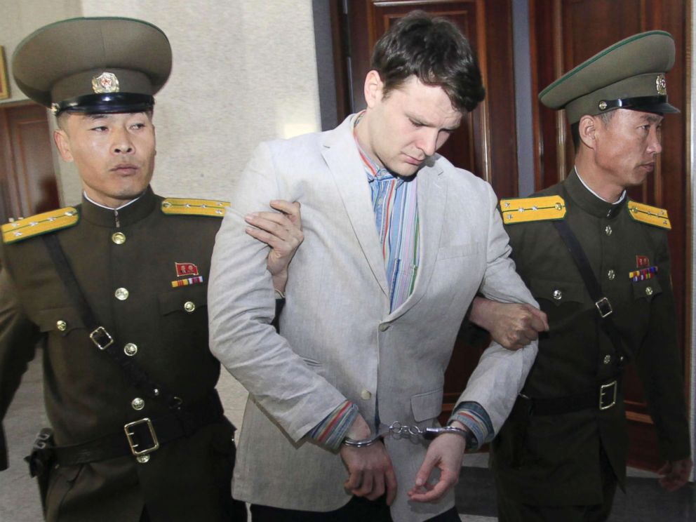 PHOTO: American student Otto Warmbier, center, is escorted at the Supreme Court in Pyongyang, North Korea, on March 16, 2016.