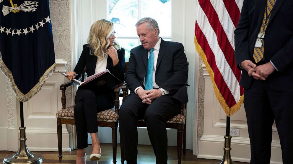 PHOTO: White House Press Secretary Kayleigh McEnany and Chief of Staff Mark Meadows talk in the Oval Office during a meeting with Iowa Governor Kim Reynolds and President Donald Trump, May 6, 2020.