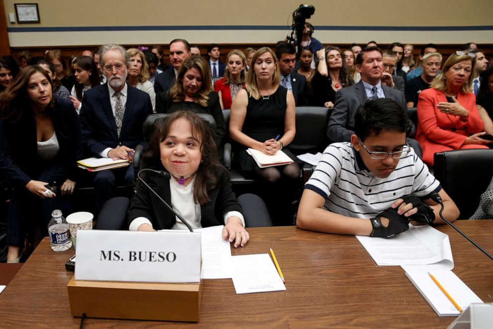 PHOTO: Maria Isabel Bueso, 24, of Concord, Calif., left, and Jonathan Sanchez, 16, of Boston, who both have medical deferred action, take their places at the start of a House Oversight subcommittee hearing, Sept. 11, 2019, on Capitol Hill in Washington.