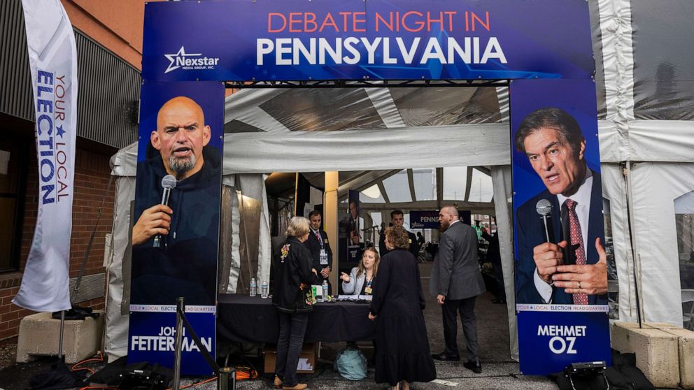  Members of the media hole   to screen  the Pennsylvania Senate statement   betwixt  Democratic campaigner  John Fetterman and Republican campaigner  Mehmet Oz successful  Harrisburg, Penn., Oct. 25, 2022.